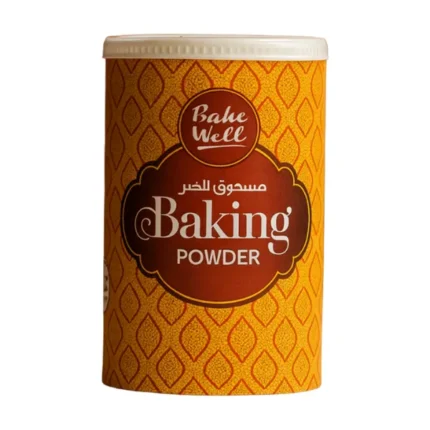 Bake Well Baking Powder container standing on a clean surface with premium yellow-red patterned packaging
