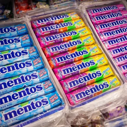Mentos assorted flavour candy rolls packed in trays with colourful wrappers for retail display